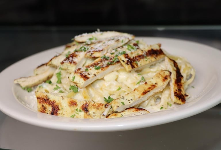 Creamy white omelette with herbs and golden brown edges on a white plate